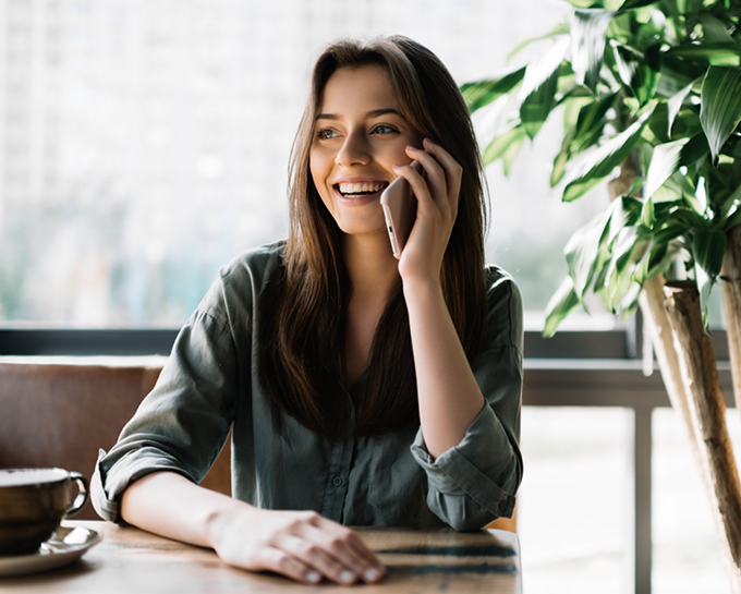 Woman smiling while talking on phone